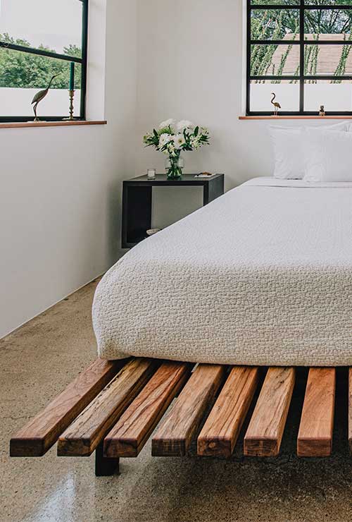 The bed is built right outside of Austin, Texas by a team of master wooderworkers.