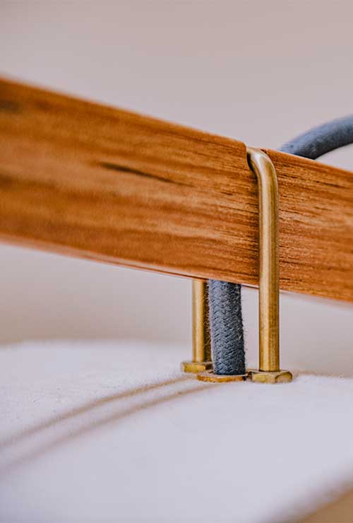 Attention to detail, the solid-brass loops that connects the cantilevered arm to the canvas lamp shade.